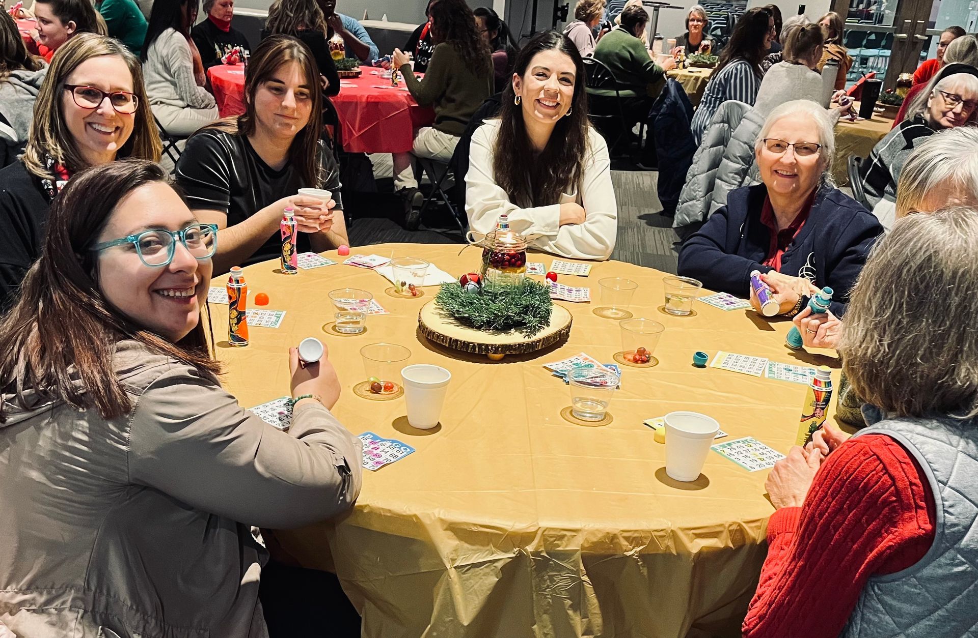 A group of people are sitting around a table.