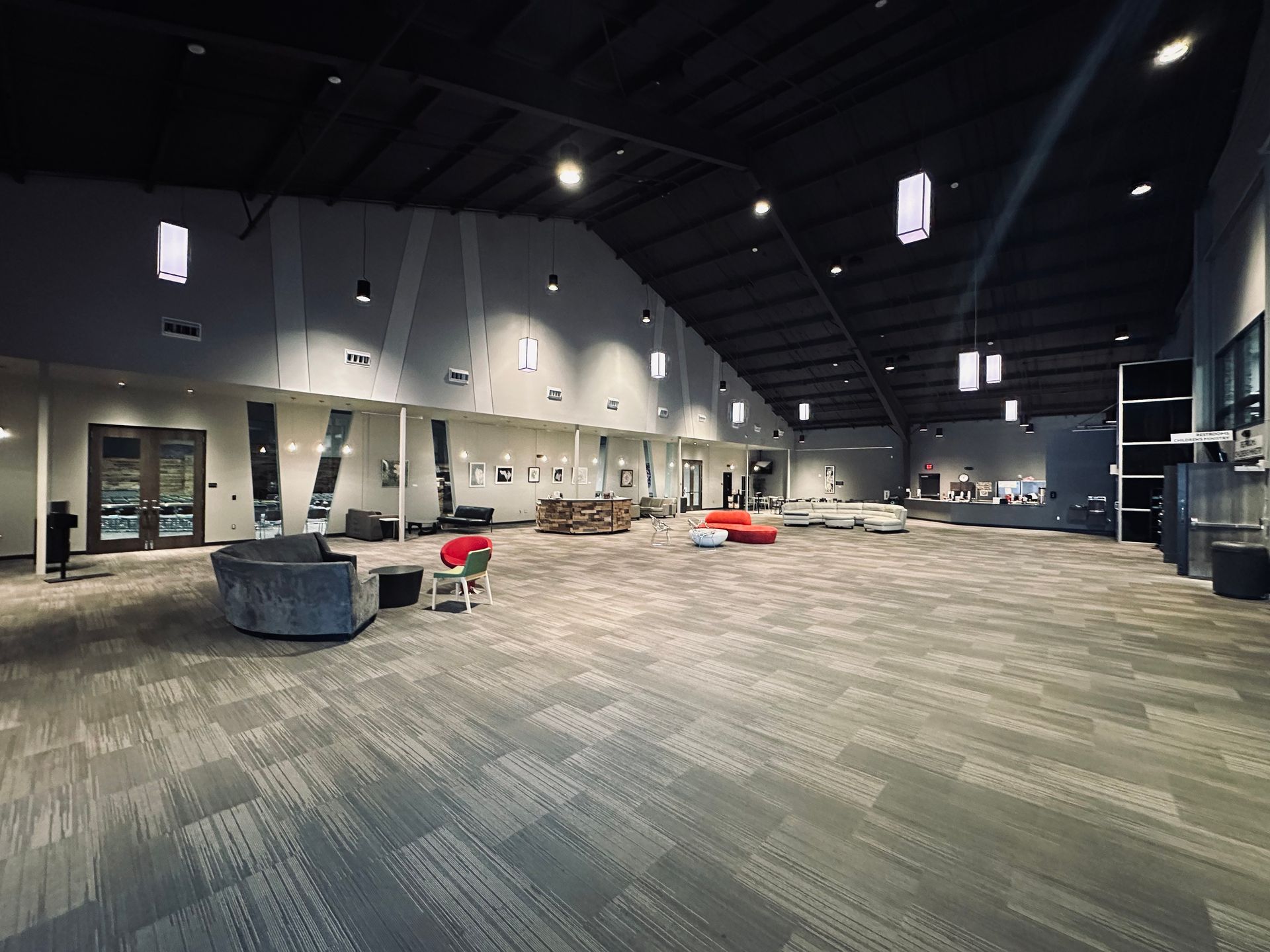 A large room with a lot of furniture in it.