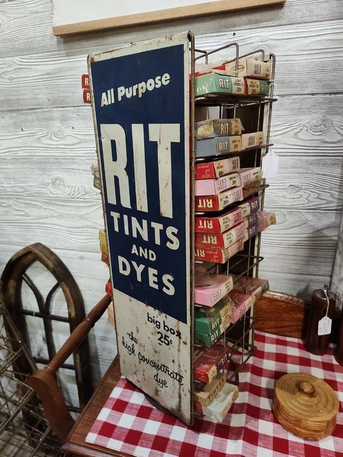Vintage Rit Tints and Dyes display with boxes of dye, red and white checkered cloth.