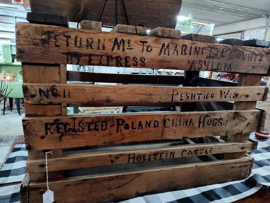 Wooden crate with faded text: 