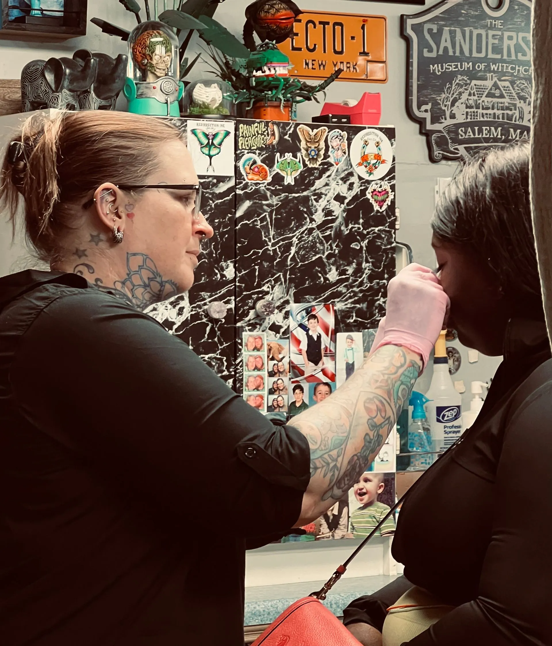 Ashton piercing a client at Resurrection Ink