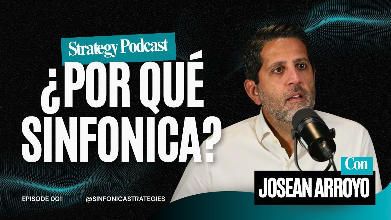 A man speaks into a microphone for the Strategy Podcast, with the title