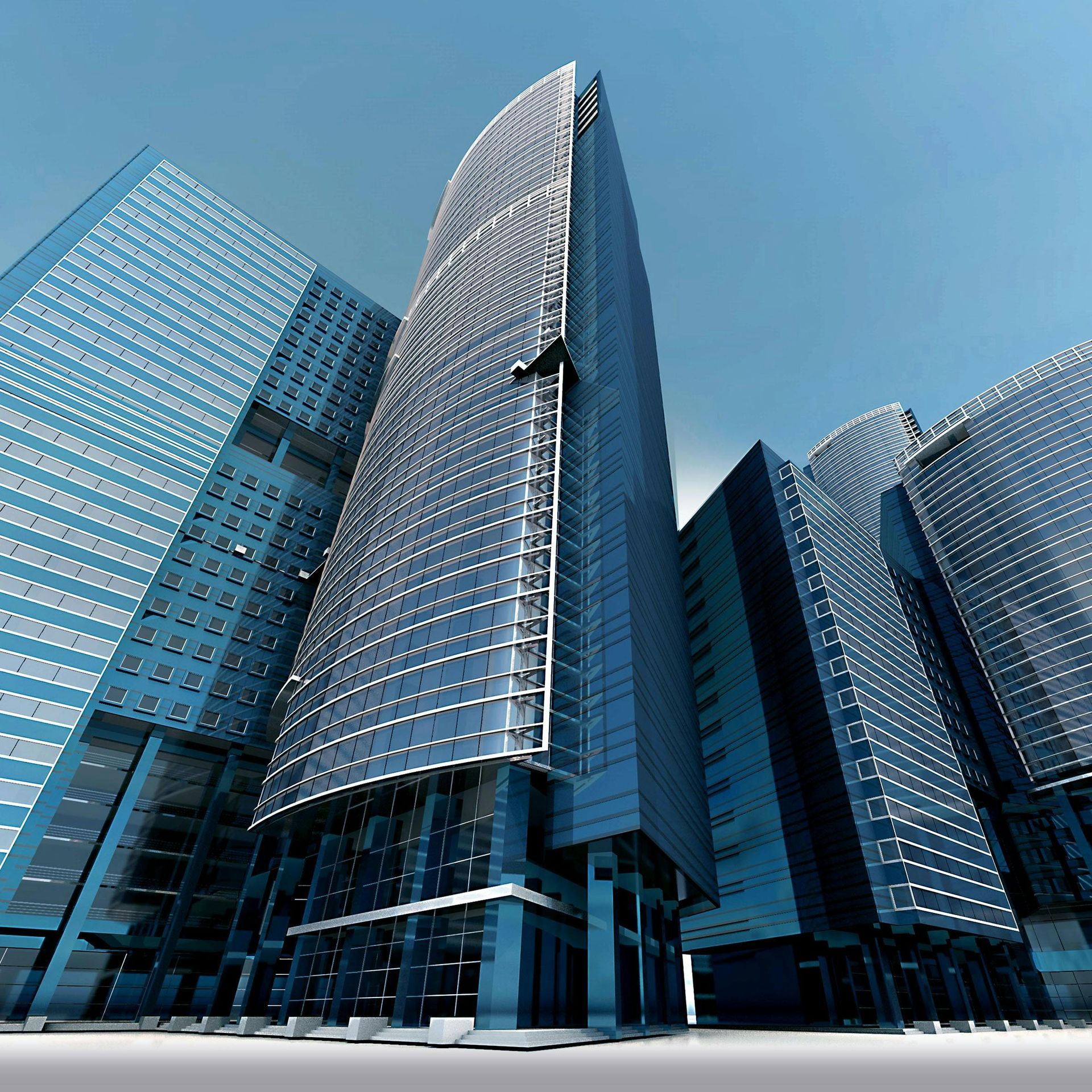 Modern blue glass skyscrapers against a clear sky.