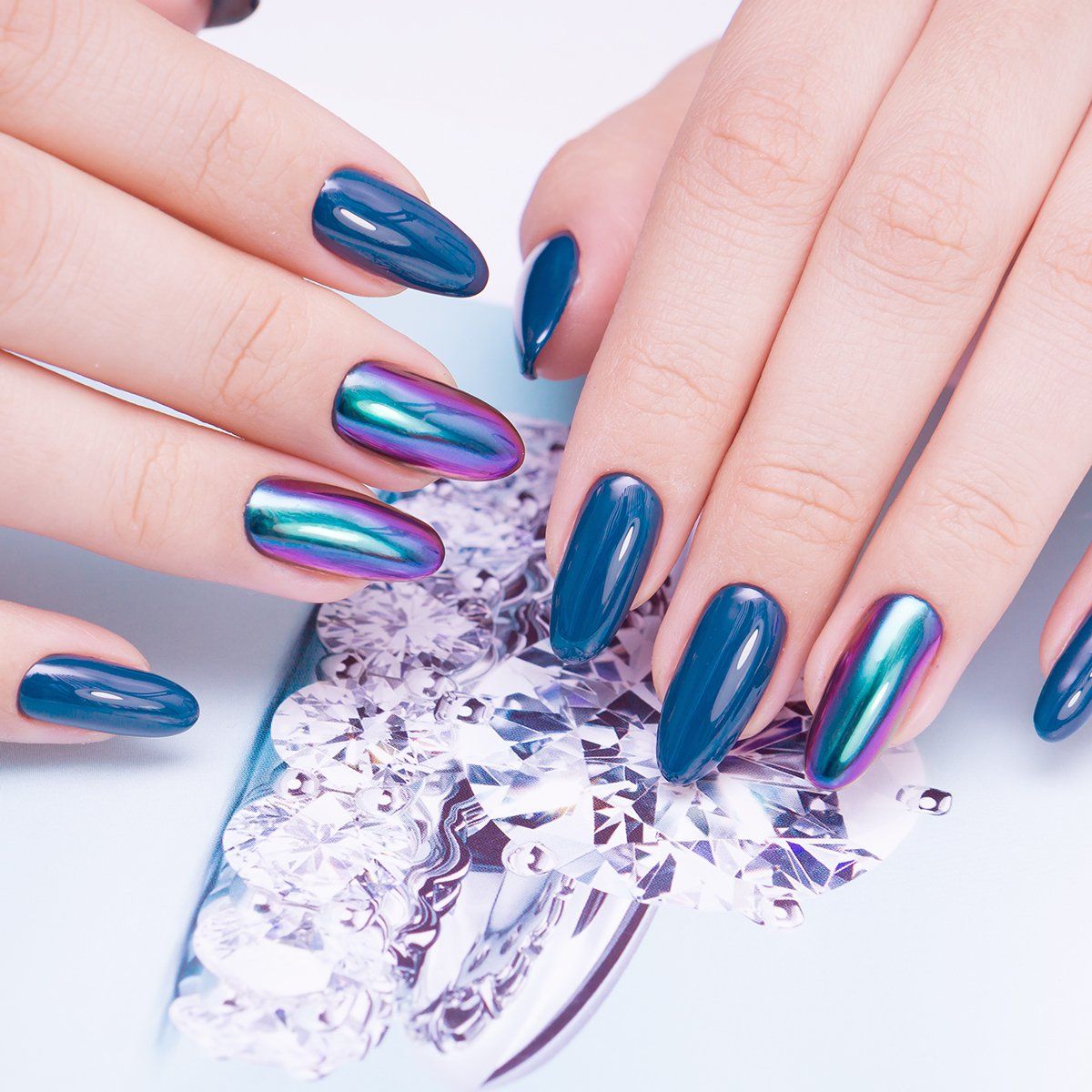 Blue gel nails with chrome holographic powder from Beautiful home salon