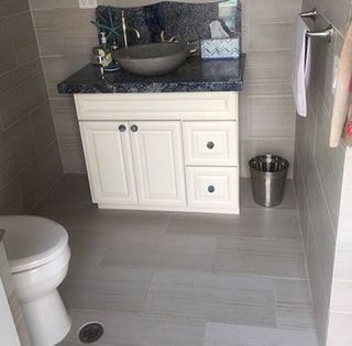 Stone & Cabinet Depot — Comfort Room with Gray Marble Flooring in San Marcos, CA
