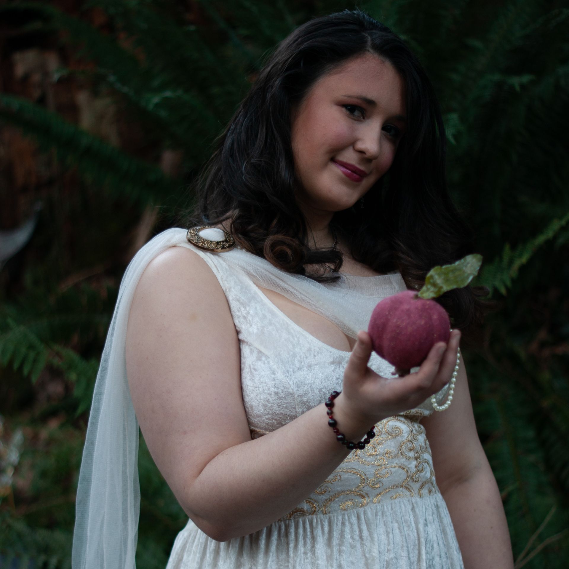 A bunch of keys are sitting on a wooden table.
