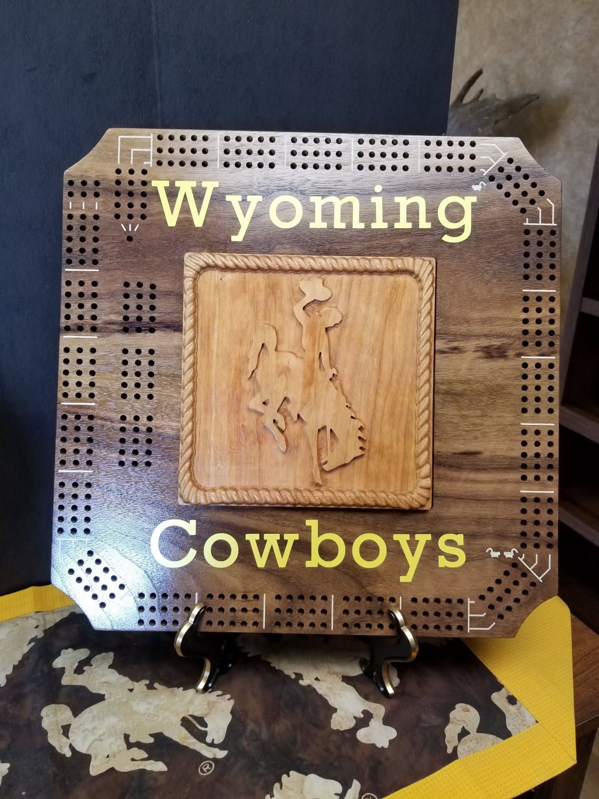 A wooden sign that says wyoming cowboys on it