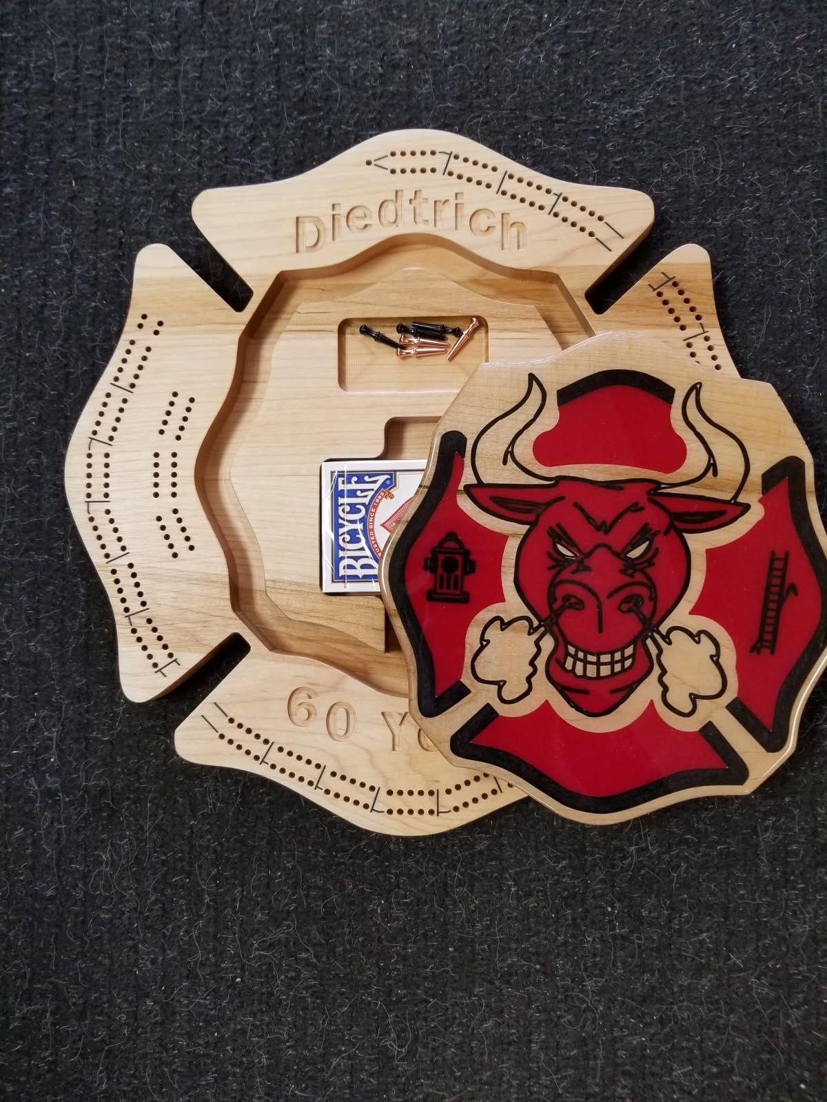 A wooden fire emblem with a bull on it