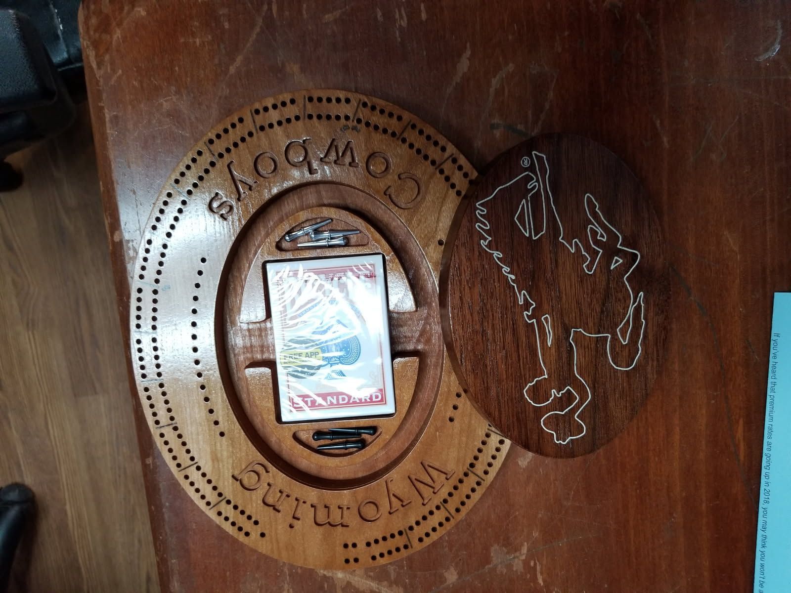 A wooden box with the word cowboy on it