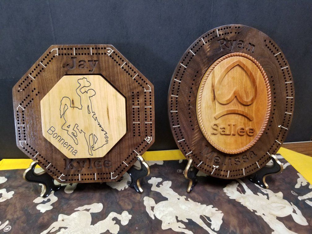 Two wooden plaques with the names jay and sallee on them