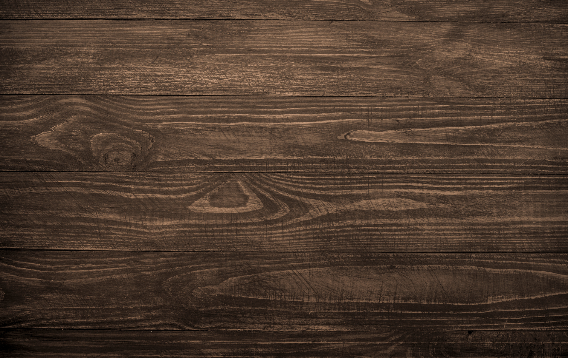 A close up of a brown wooden table.