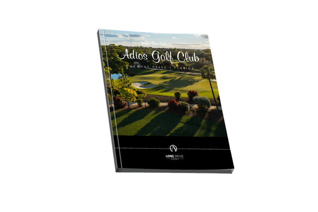 A book with a picture of a golf course on the cover.