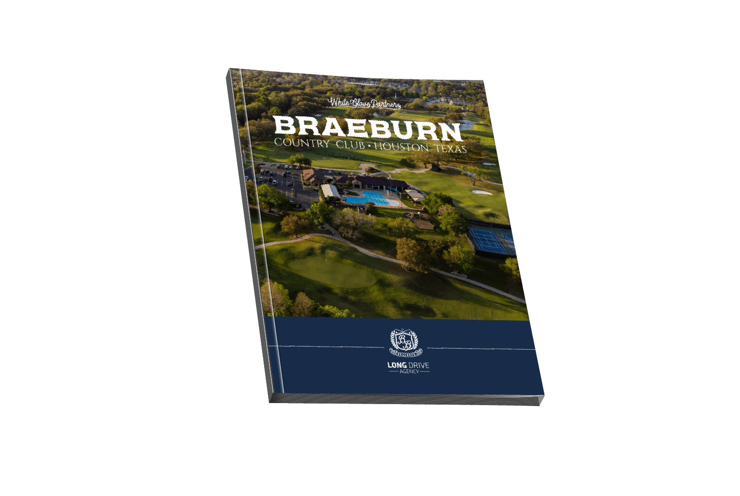 A book with an aerial view of a golf course and a pool on a white background.