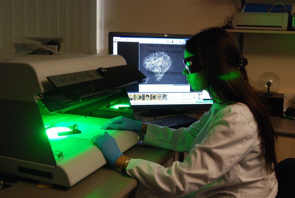Forensic expert scanning paper