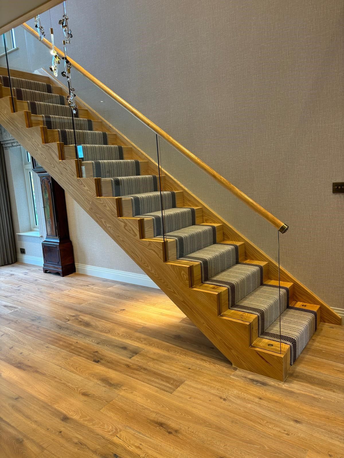 Imitation cut string oak and glass balustrade staircase