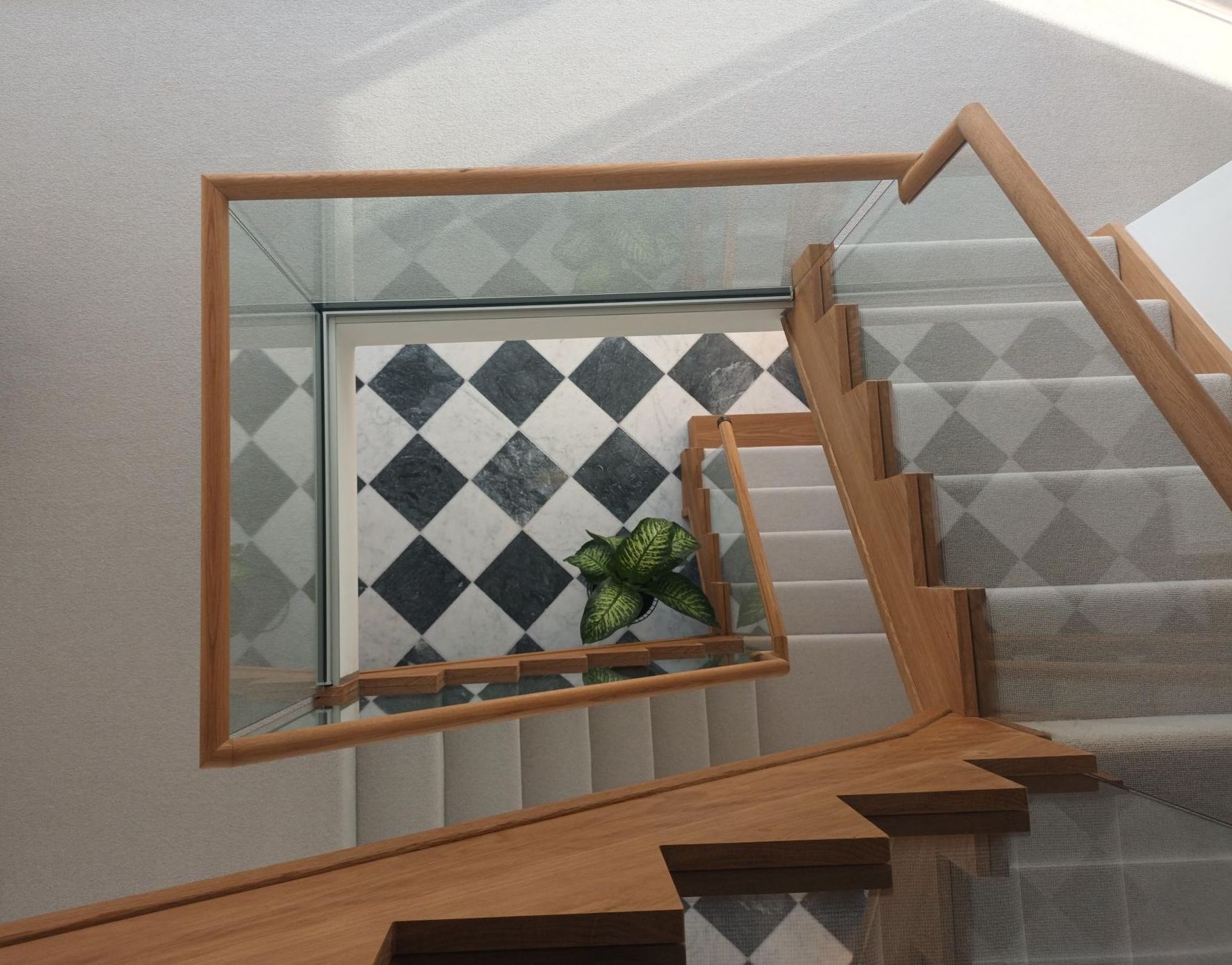 Imitation cut string staircase with glass balustrade