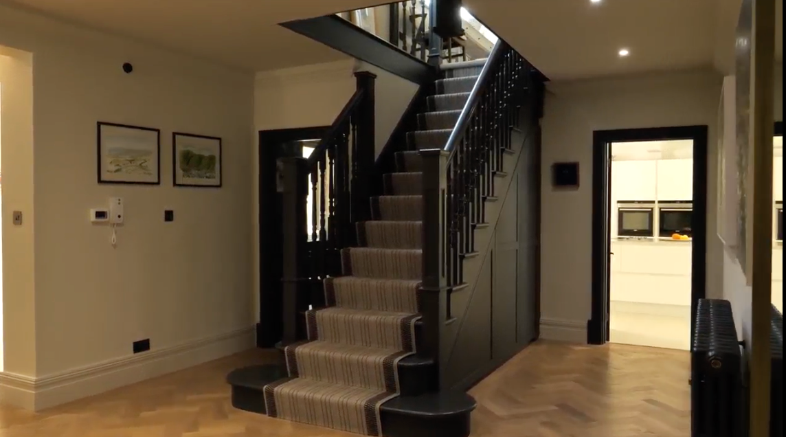 Lamp black bespoke cut string staircase