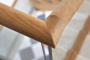 Bespoke staircase with continuous oak handrail