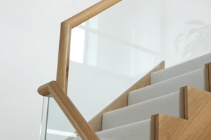 Bespoke staircase with continuous oak handrail