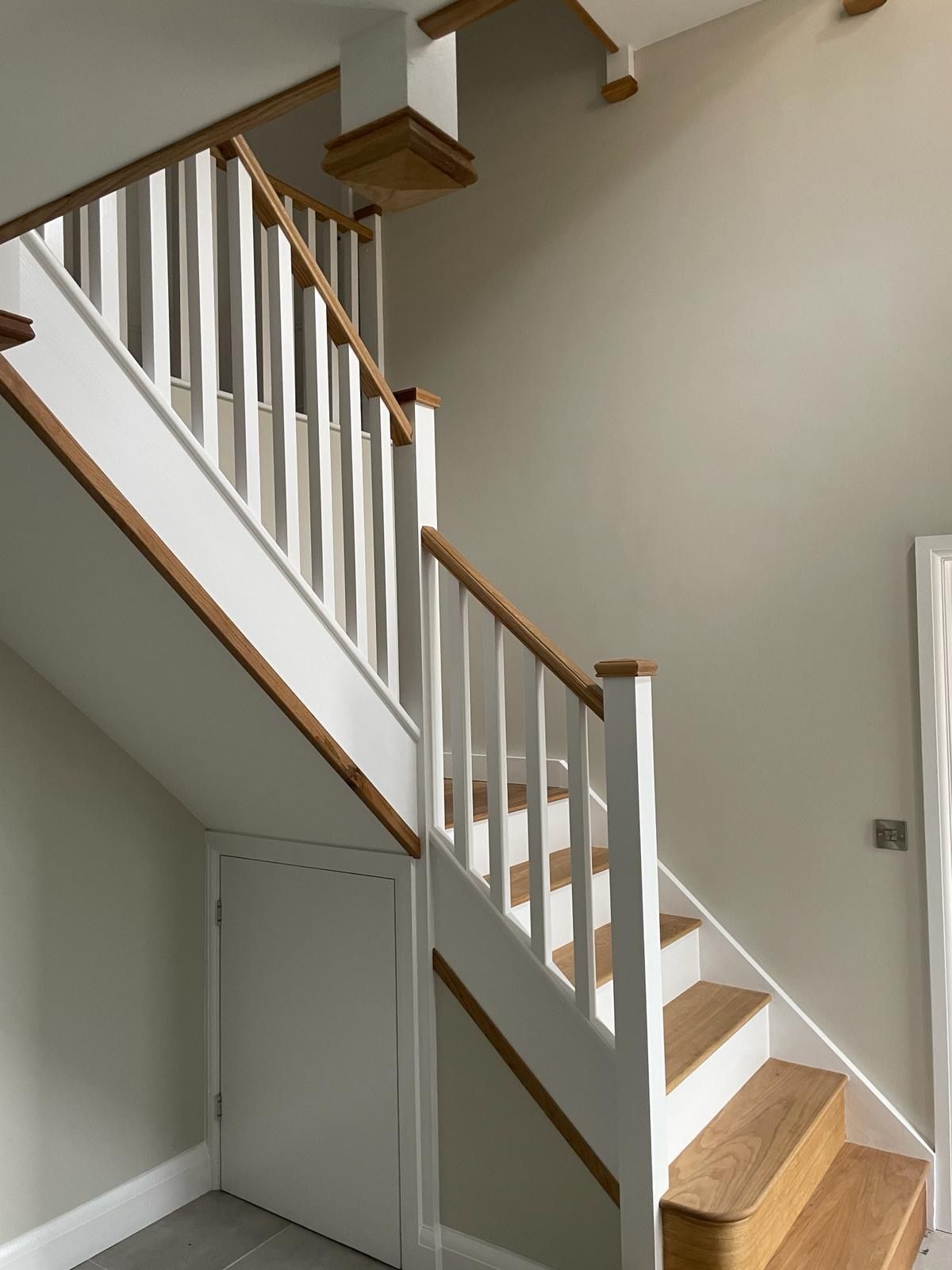 Traditional stairs with oak treads, handrails and caps