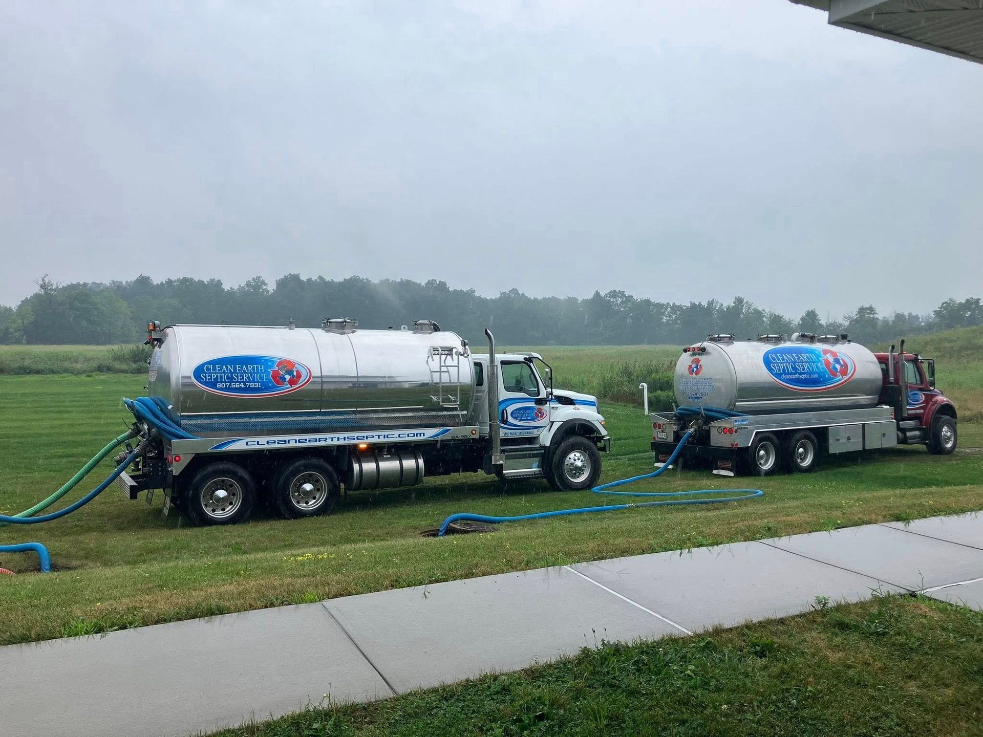 Clean Earth Septic Tanker Trucks Pumping Out Residential Septic Tanks in Elmira, NY