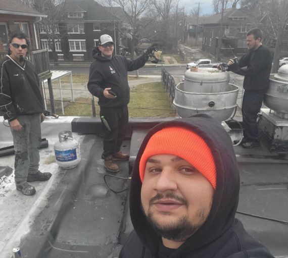 The roof of a building is covered in a gray coating.