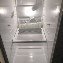 The inside of a refrigerator with the door open.