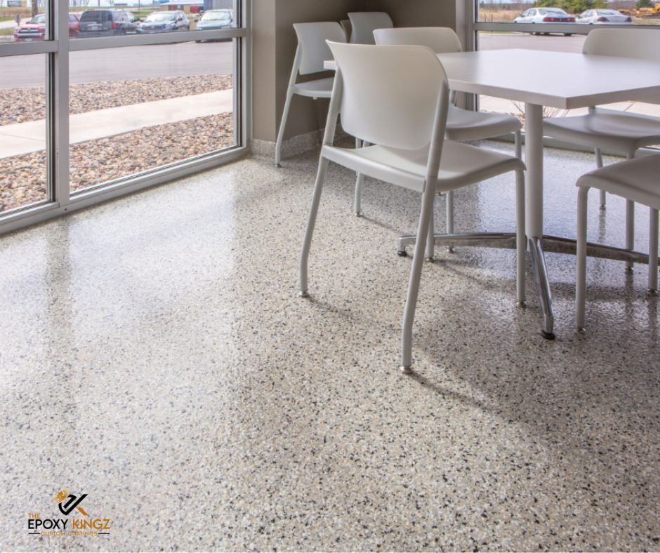 A residential garage with a custom-designed decorative flake epoxy floor