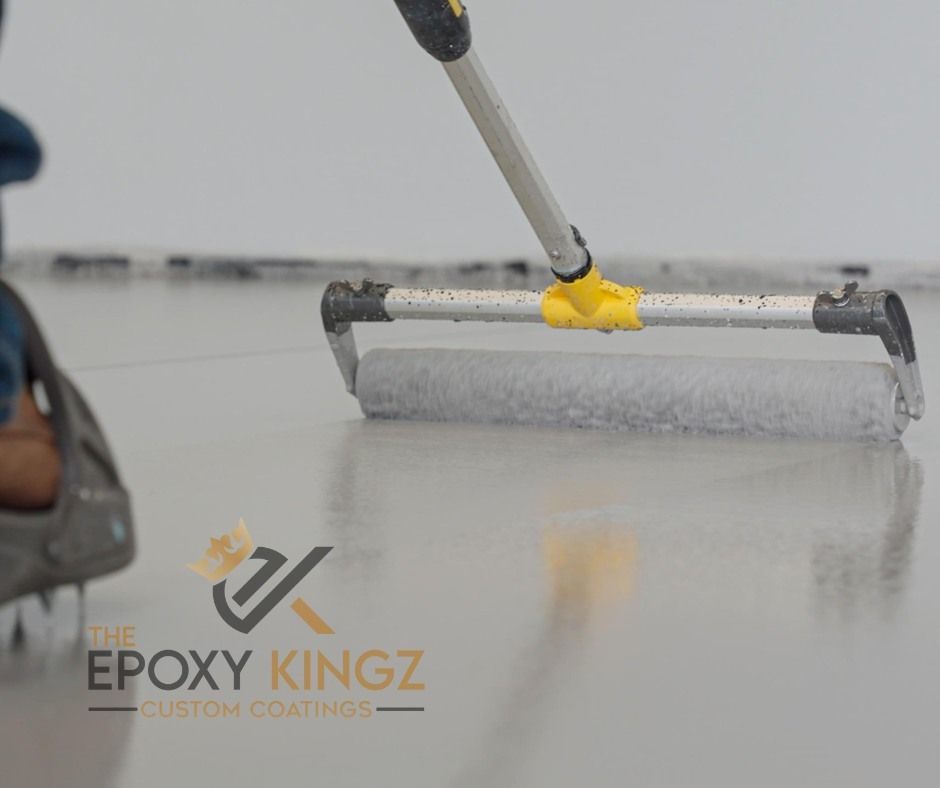 A glossy epoxy floor with a seamless, waterproof finish, designed to resist water and debris.