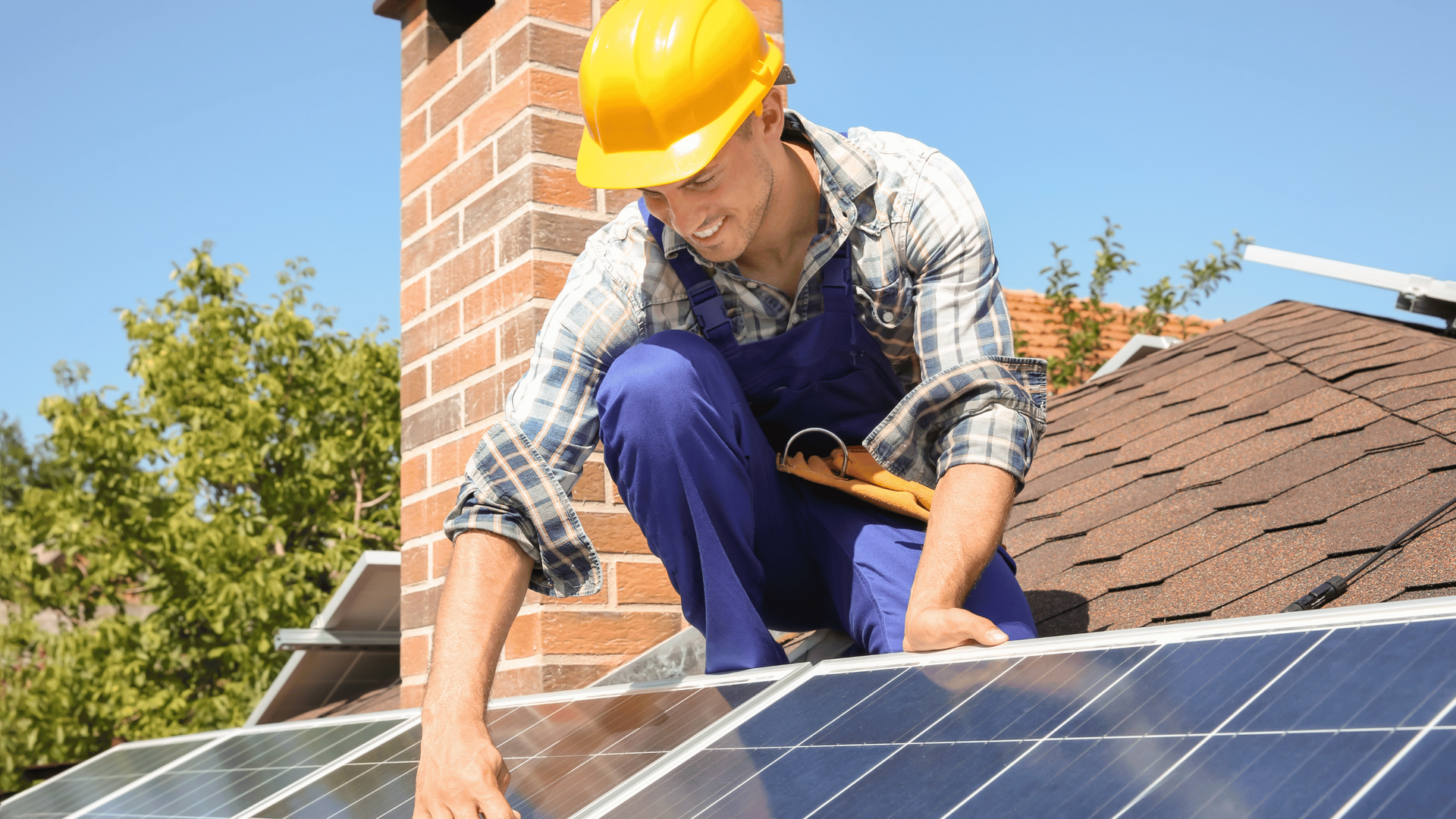 man fixing solar panel