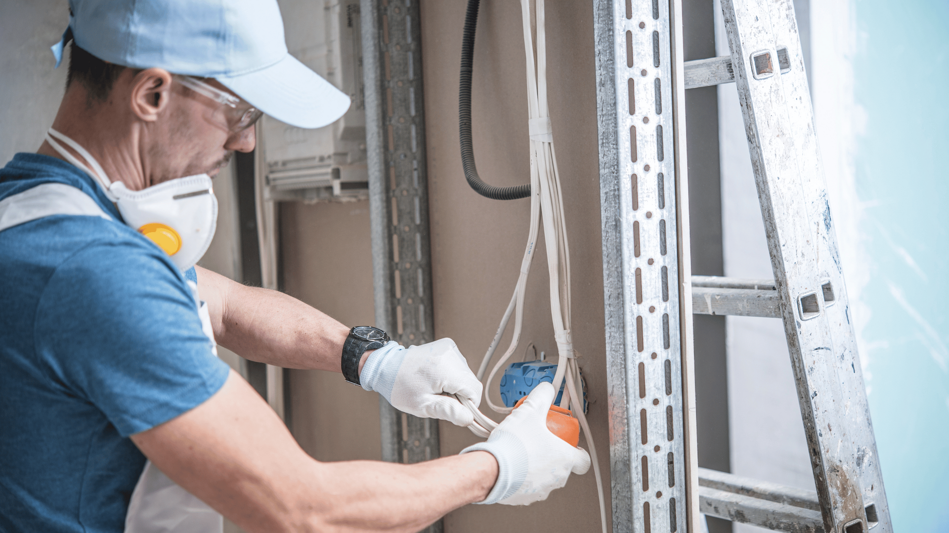 man fixing electrical outlet