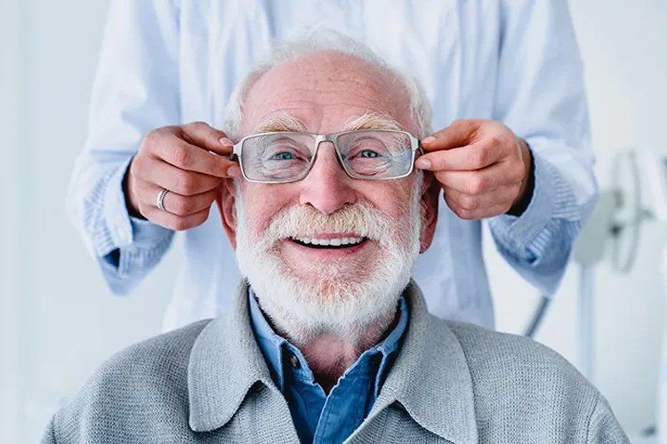 Happy elder man with eyeglasses