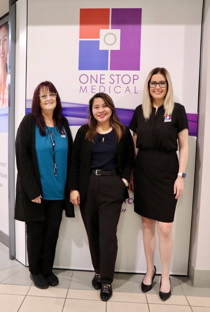 Three women in front of a 