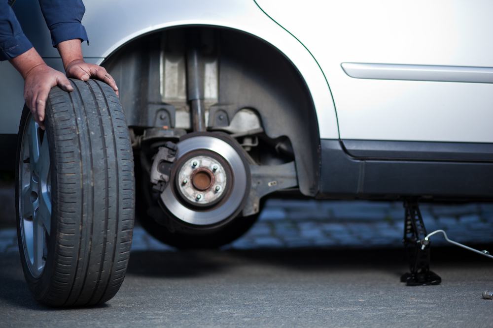 Mechanic Replacing Tyre — Tyre Service In Central Highlands, QLD