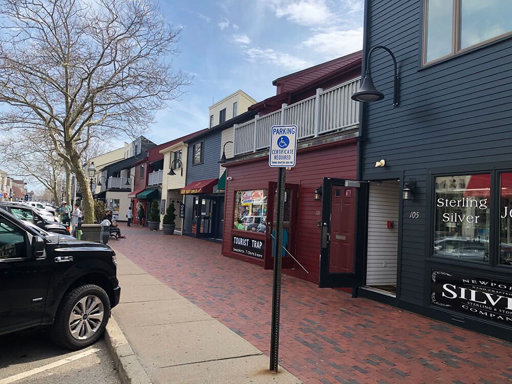 Brick-paved street with shops, including a