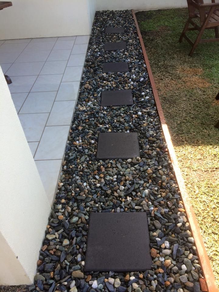 Stone Path With Dark Square Stepping Stones, Next to Grass and Building Wall — Mow & Mulch Lawn & Garden Maintenance In White Rock, QLD