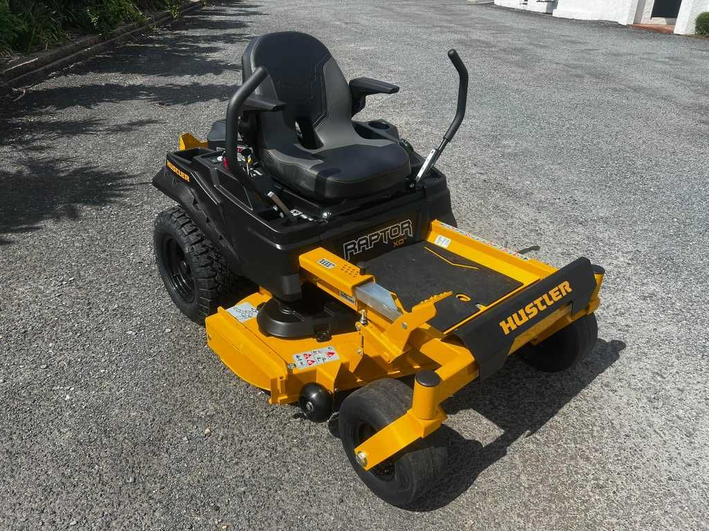 Yellow and Black Hustler Zero-turn Lawnmower on Gravel — Mow & Mulch Lawn & Garden Maintenance In White Rock, QLD