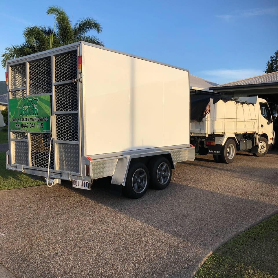 White Trailer With Caged Back, Attached to a White Truck Parked on a Driveway in Front of a House — Mow & Mulch Lawn & Garden Maintenance In White Rock, QLD