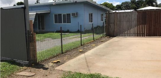 Tan House With Green Roof and Vegetation in Front — Mow & Mulch Lawn & Garden Maintenance In White Rock, QLD