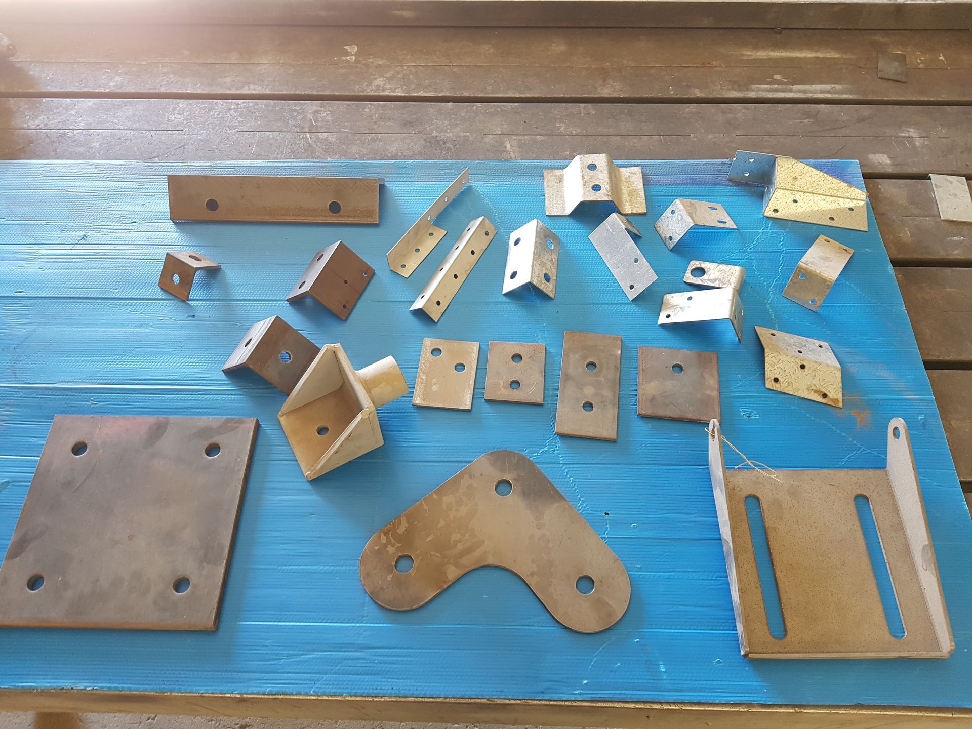 A bunch of metal pieces on a blue table