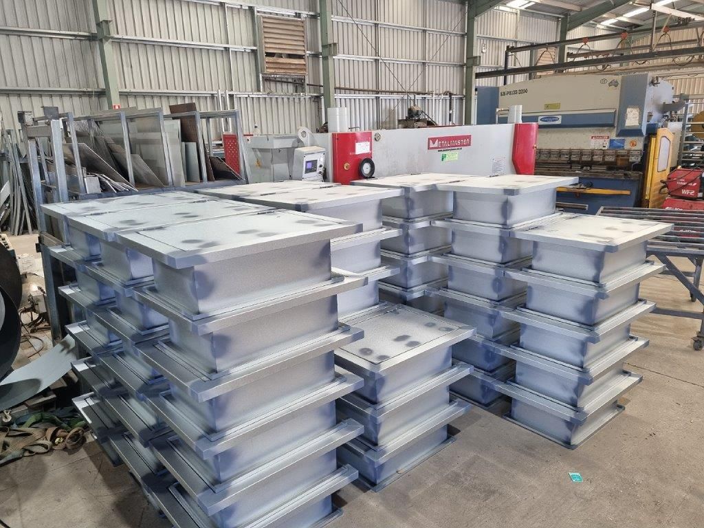 A warehouse filled with lots of boxes stacked on top of each other.