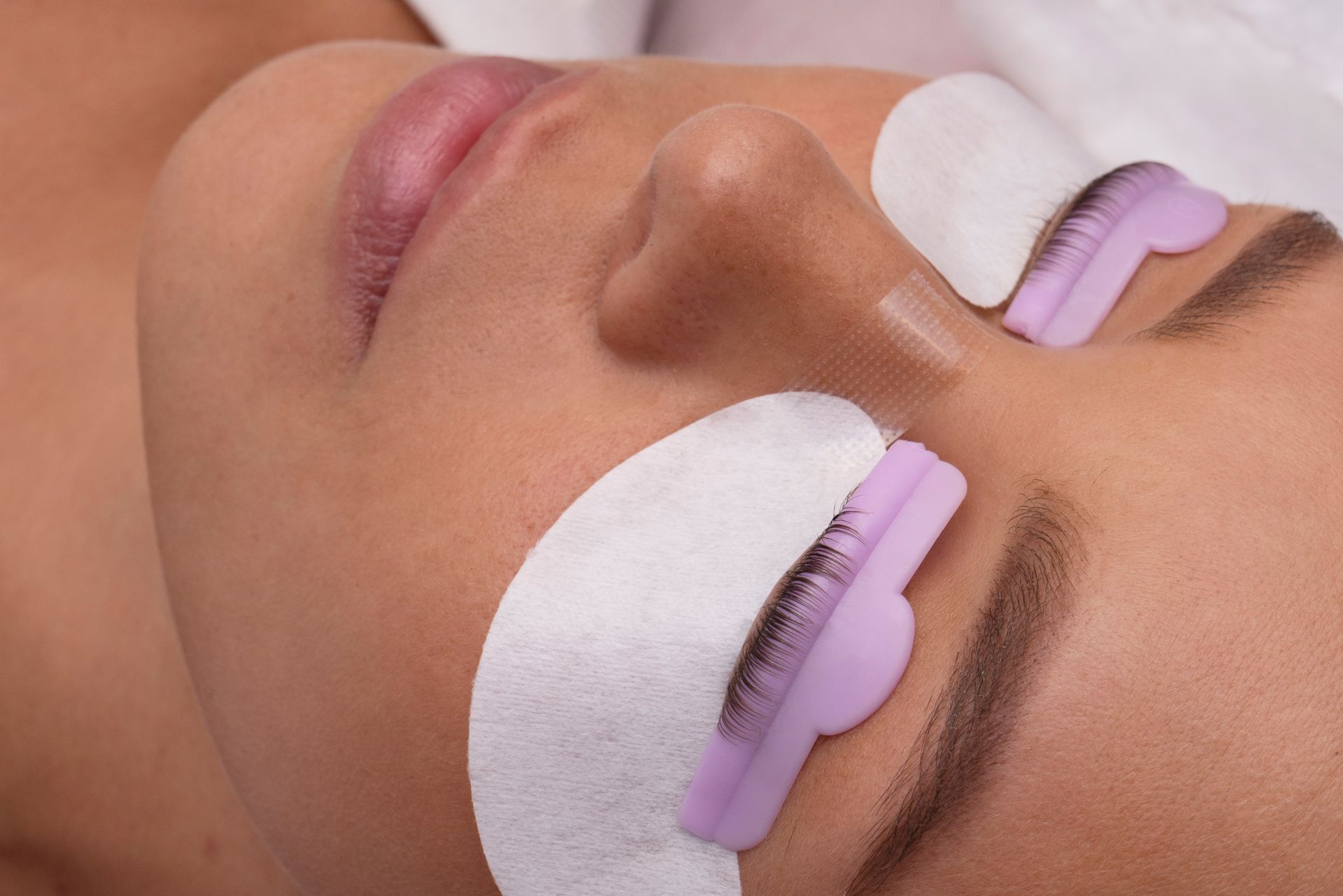 a woman is getting a lash treatment