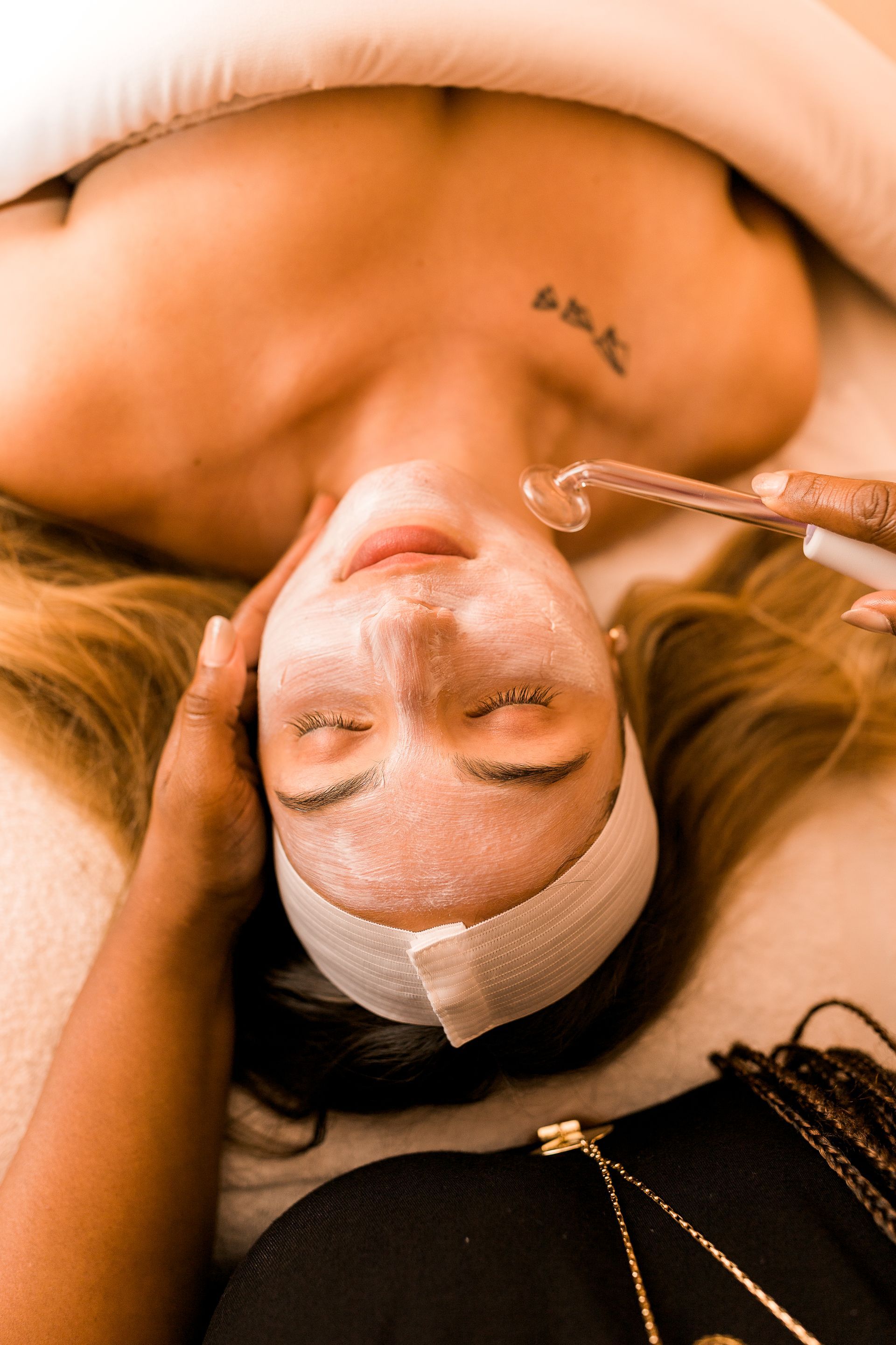 a woman is getting a facial treatment.