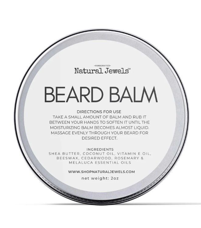 A tin of natural jewels beard balm on a white background.