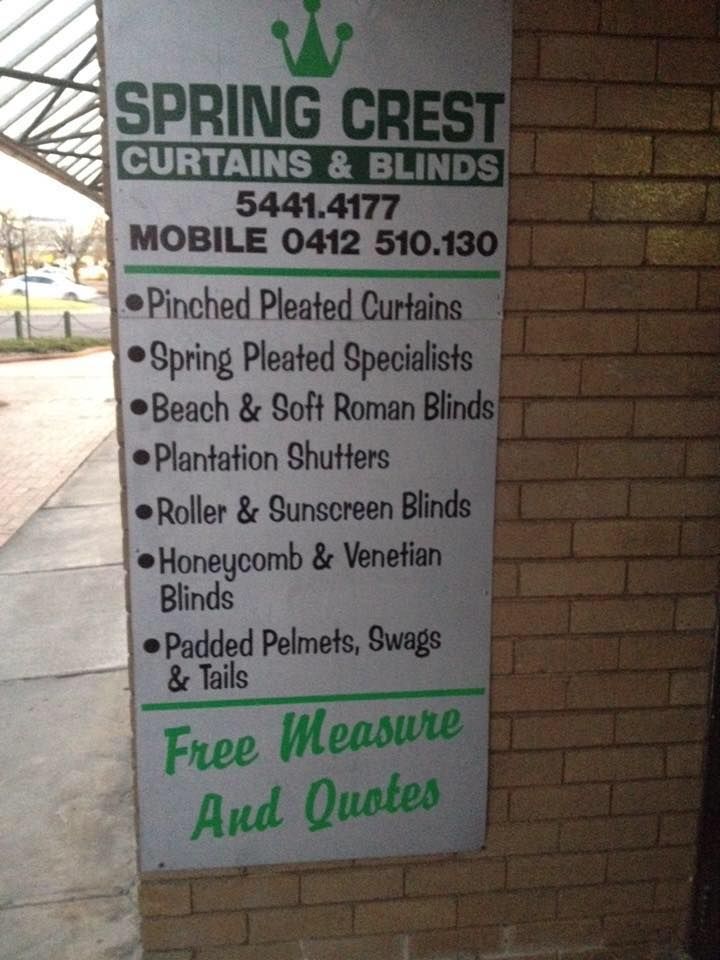 A Sign For Spring Crest Curtains And Blinds On A Brick Wall — Spring Crest Blinds, Awnings & Security Doors in Golden Square, VIC