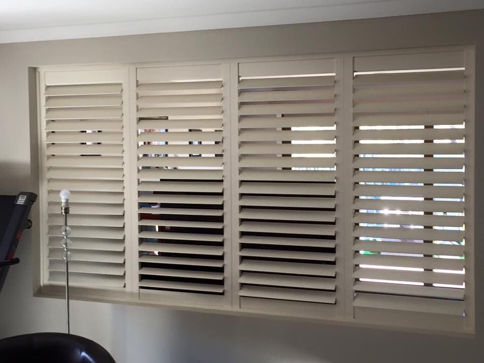 A Window With Shutters On It In A Living Room — Spring Crest Blinds, Awnings & Security Doors in Ballarat, VIC