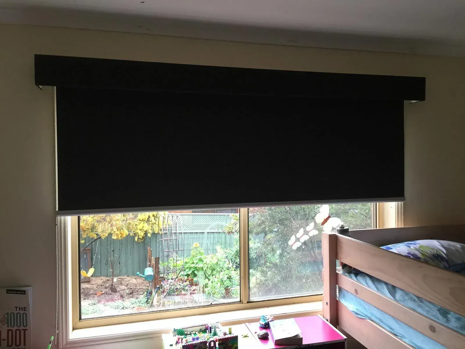 A Bedroom With A Bunk Bed And A Window With A Black Blind On It — Spring Crest Blinds, Awnings & Security Doors in Golden Square, VIC