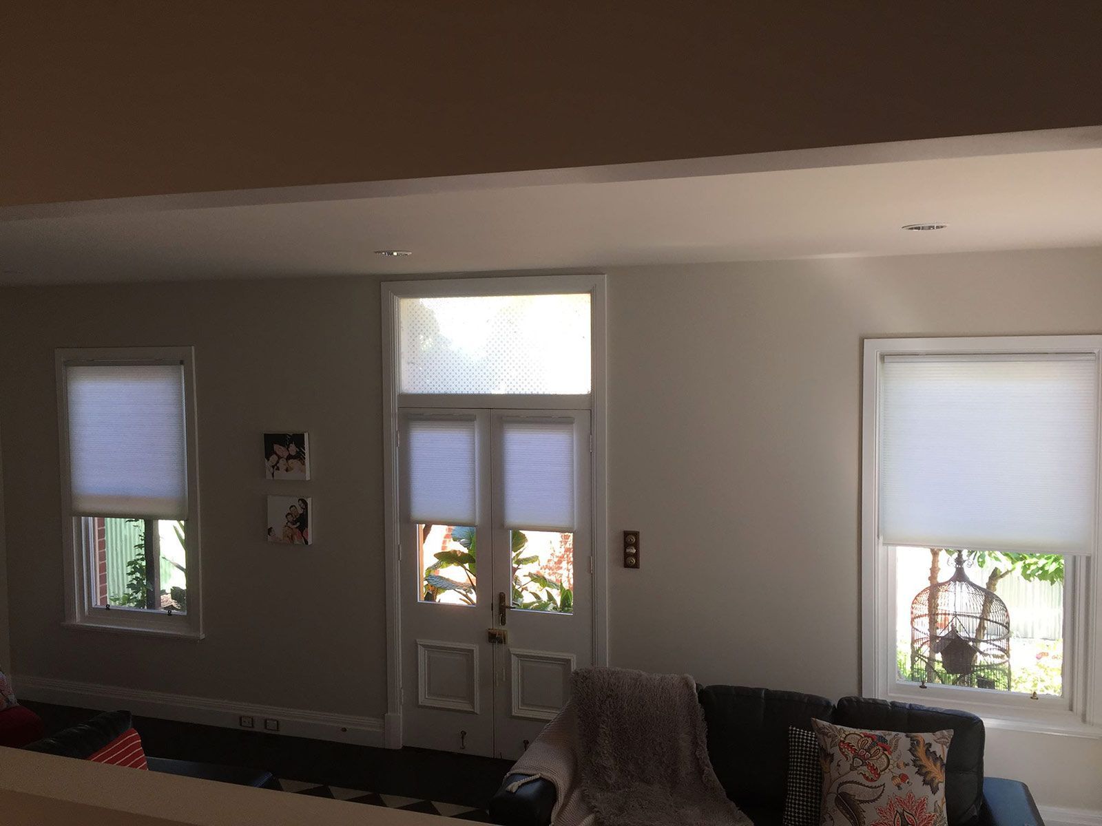 A Living Room With A Couch , Chair , And Two Windows — Spring Crest Blinds, Awnings & Security Doors in Ballarat, VIC