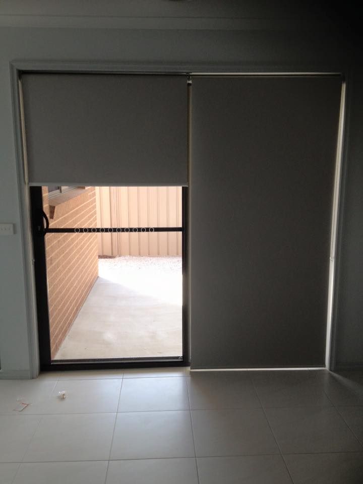 A Room With A Sliding Glass Door And Blinds On It — Spring Crest Blinds, Awnings & Security Doors in Golden Square, VIC