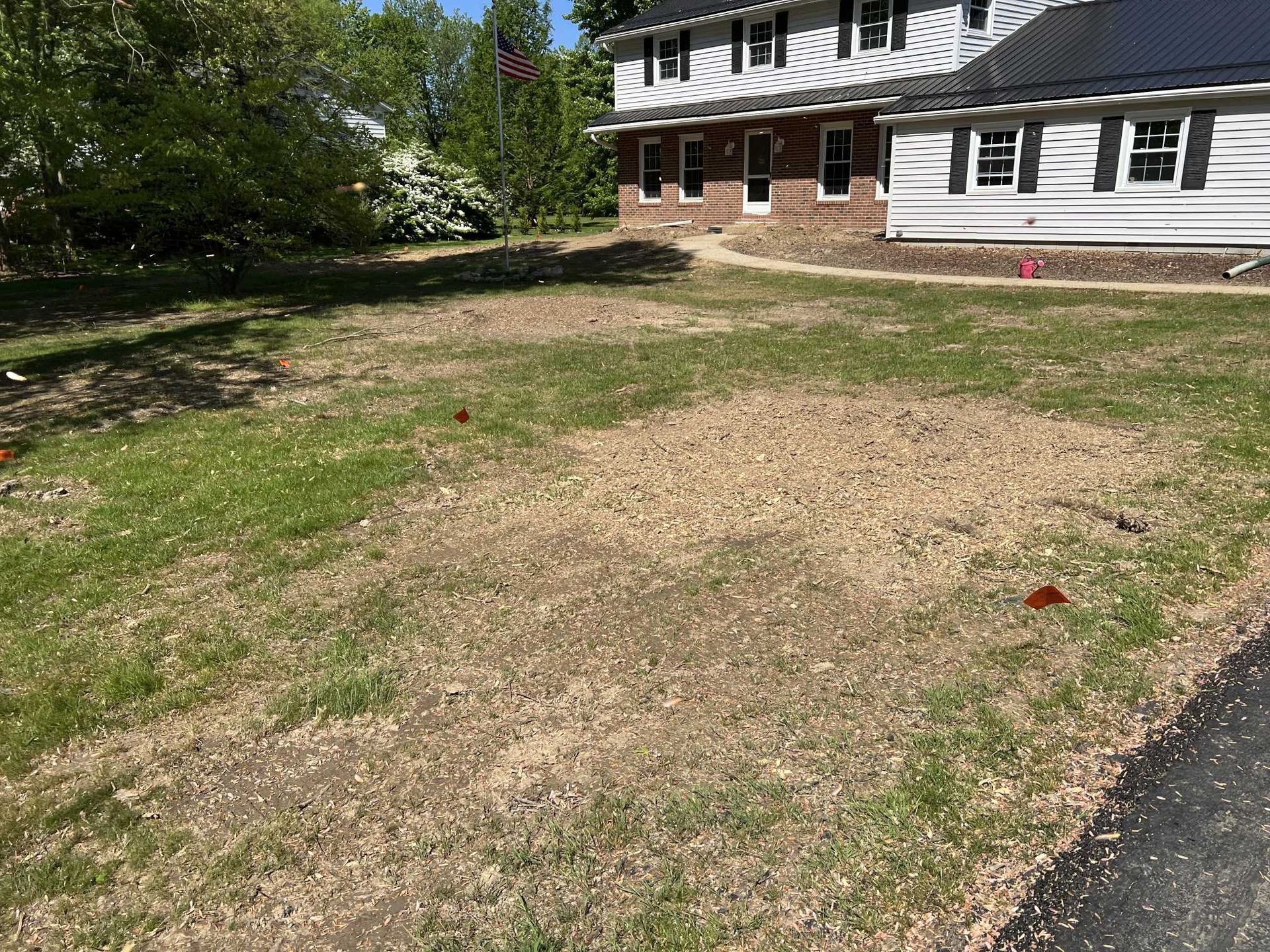 A large house with a large lawn in front of it.